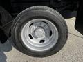 A close-up of a silver aluminum wheel with a Continental tire mounted on a 2021 Ford F-550