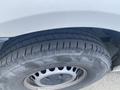 Close-up view of a tire from a 2022 Mercedes-Benz Sprinter showing the tread pattern and the rim