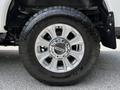 2020 Ford F-350 Super Duty wheel featuring a silver five-spoke rim and all-terrain tire with rugged tread pattern