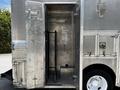 A 2008 Morgan Olson Workhorse vehicle with wide open metal doors revealing an empty, spacious interior with a single black rack mounted on one side