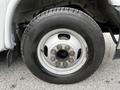 Close-up of a tire and wheel rim from a 2019 Chevrolet Express showing the tread pattern and lug nuts