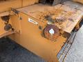 A rusted bolt on the side of a 2005 Case 570 diesel equipment with a faded label indicating diesel