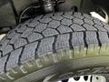 Close-up of a tire on a 2017 Mercedes-Benz Sprinter showcasing a detailed tread pattern and sidewall design