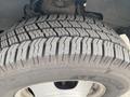 A close-up view of a tire on a 2016 Chevrolet Express showcasing detailed tread patterns and branding of the tire manufacturer