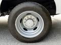 A silver wheel from a 2016 Ford F-550 featuring a six-bolt pattern and a rugged tire with the brand name Hercules visible on the sidewall
