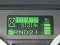 Digital display showing hour meter with reading of 5131.4 hours along with indicators for fluid levels and transmission gear selected as PRND 21