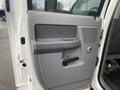 The image shows the interior driver's door of a 2008 Dodge Ram 5500 featuring a gray panel with a door handle and speaker grille