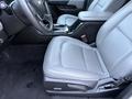 Interior of a 2018 Chevrolet Colorado showing a gray leather driver's seat and center console