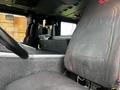Interior view of a 2009 Spartan Gladiator featuring a driver's seat and dashboard area with a focus on black upholstery and silver accents