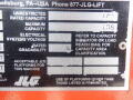 A label from a 2008 JLG Boom Lift detailing specifications such as capacity ratings electrical specifications and warning about platform use