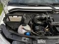 The image shows the engine compartment of a 2017 Mercedes-Benz Sprinter with visible components like the air filter battery and coolant reservoir