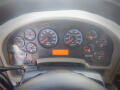 Dashboard of a 2016 International WorkStar 7500 displaying various gauges for speed, fuel, and engine diagnostics along with warning lights and an odometer reading