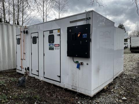 A Huntair Custom Air Handler Unit with a white exterior featuring multiple access doors and a control panel on one side