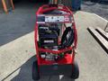 2024 Magnum 4000 Hot Water Pressure Washer with a red frame cockpit and various control buttons attached to the front of the unit