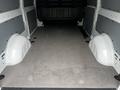 Interior view of a 2023 Mercedes-Benz Metris cargo van showing a spacious, empty floor with side walls and wheel wells visible