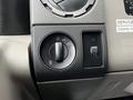 Close-up of the control panel in a 2008 Ford F-450 SD featuring knobs for headlights fog lights and other settings