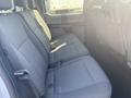 Interior view of the back seat of a 2017 Ford F-150 with fabric upholstery and seating for three passengers