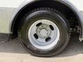 Close-up of a wheel from a 2017 Chevrolet Express showing a silver rim and a black tire with visible tread patterns