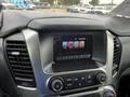 Dashboard of a 2016 Chevrolet Tahoe featuring a touchscreen display with audio and phone settings and control buttons below