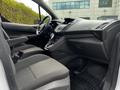 Interior view of a 2016 Ford Transit Connect showing the front seats dashboard and center console