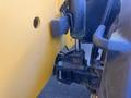 Close-up of the hydraulic system and lifting mechanism of a 2013 JCB 510-56 Loadall with yellow and black elements