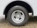 A close-up view of a silver wheel and tire from a 2020 Chevrolet Express showing the tire tread and rim design