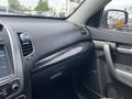 Interior view of a 2015 Kia Sorento dashboard featuring controls touchscreen display and trim details