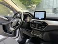 Interior view of a 2020 Ford Escape featuring a modern dashboard with a touchscreen display steering wheel and control panel