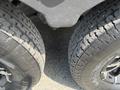 Close-up of two tires from a 2013 Outdoor Wind River showing tread patterns and sidewall details
