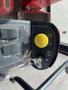Close-up of the control panel of a 2012 Toro Groundsmaster 5910 featuring buttons for various functions and a yellow ignition switch with a key inserted