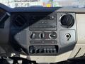 Dashboard of a 2008 Ford F-550 featuring audio controls climate knobs and various switches for auxiliary functions