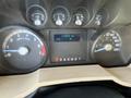 Dashboard of a 2014 Ford F-350 SD showing speedometer tachometer and odometer displaying 213570 km with a temperature reading of 24 degrees Celsius