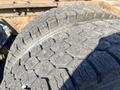 Close-up of a worn tire showing detailed tread patterns on a 2009 Peterbilt Highway truck