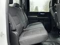 The back seat of a 2021 Chevrolet Silverado 3500HD with gray upholstery and ample legroom