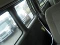 2011 Chevrolet Express van interior with gray upholstery and visible front seats