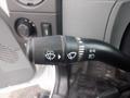 A close-up of a control stalk from a 2011 Ford F-750 featuring various icons for wipers headlights and turn signals