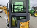 2024 AGT Industrial Yellow H13R Mini Excavator focused on its cab with large windows and a visible control panel inside