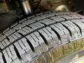 Close-up of a tire from a 2017 Ford Transit displaying detailed tread patterns and textures