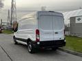 A white 2017 Ford Transit van parked with a plain rear view showing the doors and rear lights