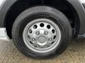 A close-up view of a silver wheel and tire from a 2021 Ford Transit showing a Continental tire and five lug nut design