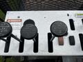 Close-up of lever controls for a 2008 International 7500 truck featuring labels for winch and boom with up and down indicators