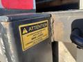 A close-up of a warning label on a 2013 International 4300 indicating a maximum capacity of 4000 pounds