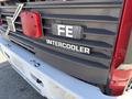 A rear view of a red 1994 Volvo FE 42 showing the logo with the letters FE and the word INTERCOOLER beneath it