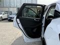 A 2020 Ford Escape with an open driver's side door featuring a sleek interior design and modern paneling