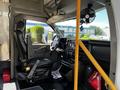 Interior of a 2019 Chevrolet Express showing the driver's seat steering wheel dashboard and center console
