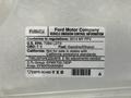 2014 Ford F-150 with a vehicle emission control information label displaying regulatory details and specifications