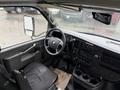 Interior view of a 2019 Chevrolet Express with a driver's seat steering wheel dashboard and control panel visible
