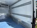 Interior of a 2016 Mercedes-Benz Sprinter showing a spacious cargo area with metal strips on the walls and a blue floor