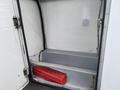 A 2003 Ford F-450 SD truck with an open rear compartment showcasing a red toolbox sitting on a metal frame