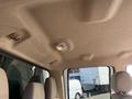 Interior view of a 2014 Ford F-350 SD showing the overhead ceiling with light fixture and seating area